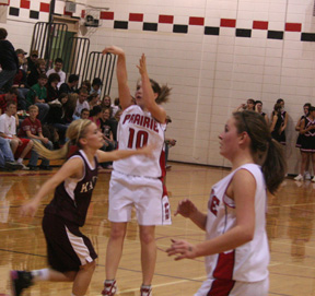 Megan Sigler puts up a 3-pointer as Meaghan Bruner watches the flight of the ball.