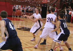 David Sigler makes a pass from the top of the circle against Grangeville as Derek Schaeffer sets a pick.