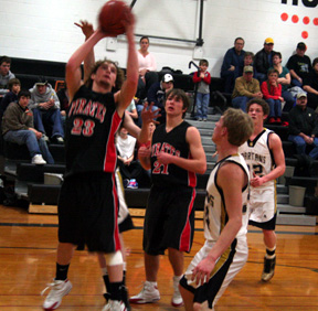 David Sigler gets inside for a layup at Timberline. To his left is Conner Rieman.