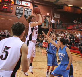 David Sigler puts up a shot against Lapwai. At left is Seth Guyer while at right is Branden Waller.