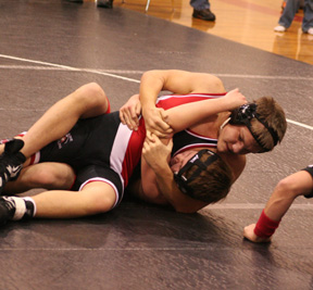 Josh Wimer is about to pin his opponent at the Prairie home meet last Friday.