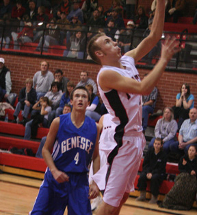 Devin Schmidt scores a lay-up against Genesee.