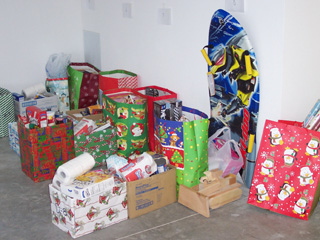 Angel Tree gifts and food boxes sorted and prepared for delivery by Santa’s helpers at SMHC and other elves from the community.