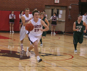 Andrew Gabica leads a fast break after a Potlatch turnover. In the back is Devin Schmidt.