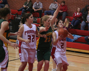Fran Johnson tries to get a shot up inside. At left is Haleigh Schmidt.