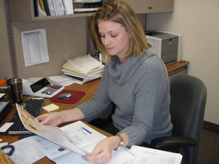 Lenne Bonner, CFO, reviews information from HealthFirst, a company both Clearwater Valley and St. Marys Hospitals will partner with for financial services.