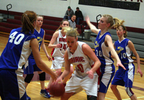 Mary Shears moves toward the hoop against North Idaho Christian. In the background is Kayla Johnson.