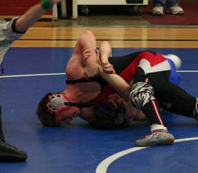 Brandon Poxleitner has Orofino's Michael Skinner in trouble but the time ran out before he could finish him off.