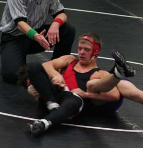 Damian McWilliams tries to get his opponent's shoulders turned toward the mat.