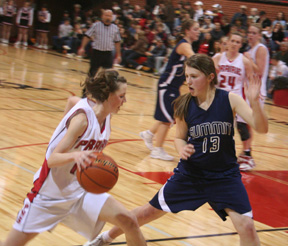 Prairies MaKayla Schaeffer tries to drive past Summits Rachel Wemhoff. In the background are Summits Jamie Chmelik and Prairies Kayla Johnson and Mary Shears.