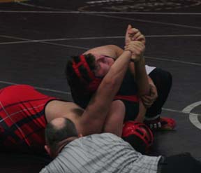 Mitch Jungert pins a Wallace wrestler to close out Prairie's dual against the Miners.