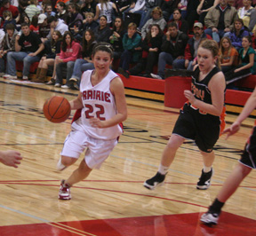 Amber Holthaus drives into the lane against Troy.