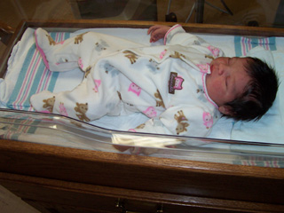 Taylor Prado, daughter of Casey and Josh Prado, born on January 10 at St. Marys Hospital is one of the first to use the new infant crib purchased with a Berklund Foundation grant.