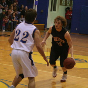 David Sigler handles the ball with Jordan Killmar defending for Nezperce.