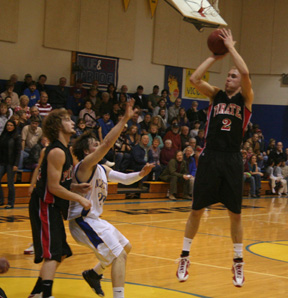 Devin Schmidt goes for two at Nezperce. At left is David Sigler.