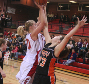 Mary Shears gets checked by Troy's Tai Jensen.