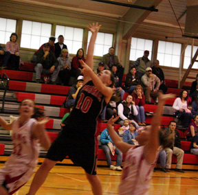 Megan Sigler goes for a layup against C.V.