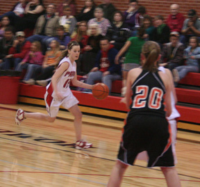 NaTosha Schaeffer brings the ball up against Troy.