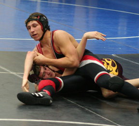 Tyrell Langston is about to pin a Kamiah wrestler on his way to a second place finish.