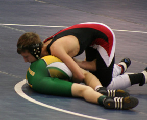 Alex Duman attempts to roll over a Potlatch wrestler.