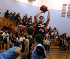 Branden Waller rises up for a jump shot from the elbow at Lapwai. In front is Andrew Gabica.