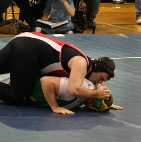 Joe Schumacher grapples with Cummins from Potlatch.