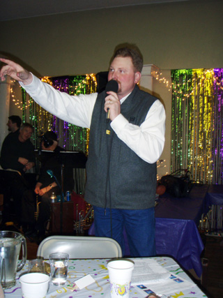 Shane Arnzen encourages bidding on five different items during the live auction at this year’s SMHC Foundation Mardi Gras