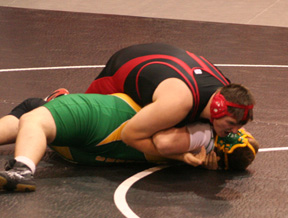 Mitch Jungert is about to pin Cummins of Potlatch.