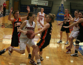 NaTosha Schaeffer gets caught up in a double team by Kendrick. In the background is Megan Sigler and at right is Kayla Johnson.