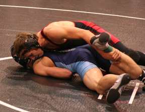 Tyrell Langston maneuvers a Grangeville opponent. He won a close match and later was injured in a match against a Potlatch wrestler.