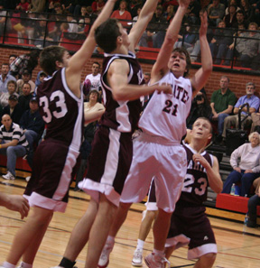 Conner Rieman draws a lot of defenders as he puts up a shot against Kamiah.