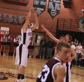 David Sigler puts up an outside shot against Kamiah as Branden Waller watches the flight of the ball.