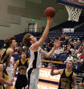 David Sigler scores one of many lay-ups the Pirates scored in the second quarter against Timberline.