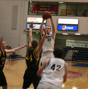 Dylan Prigge makes a pass to Josh Frei during Summit's District opener against Highland.