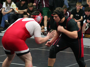 Joe Schumacher faces defending district champion Ty Beare of Kootenai. Schumacher scored a last second takedown to win the match and clinch a trip to state.