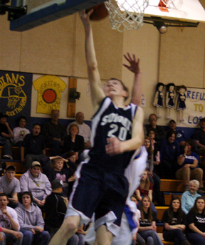 Austin Chmelik lays the ball up against Nezperce. He was Summits leading scorer in the game.