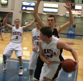 Branden Waller looks to make a pass. Also shown are Devin Schmidt and Derek Schaeffer.