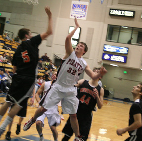 Branden Waller puts up a shot against Kendrick in the District championship game. Behind him is Andrew Gabica.