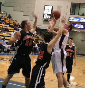 Devin Schmidt puts up a contested shot against Kendrick.