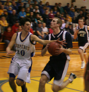Dylan Prigge has the ball knocked away from him by Nezperces Chris Riggers in the District title game. Josh Frei is in the background.