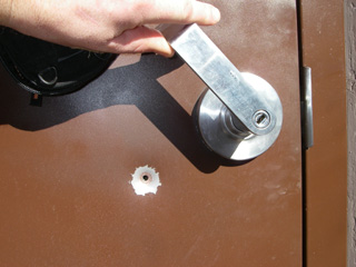A bullet hole in the toilet door at Pine Bar Recreation Area. Anyone with information concerning the vandalism is asked to contact either the BLM Ranger or the Idaho County Sheriffs Dept.