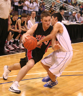 Andrew Gabica drives past a Castleford defender who appears to be either fouling him or trying to draw a charge.