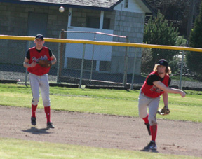 Shortstop David Sigler throws to first in the Kendrick game as third baseman Devin Schmidt watches.