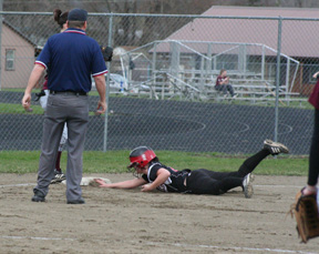 Haleigh Schmidt slides into third with a first inning triple at Kamiah.