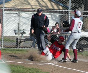 Kyle Holthaus slides into home with the first run of the game at Kamiah.