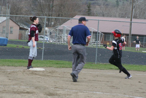 Megan Sigler is about to round third on her leadoff homer at Kamiah.