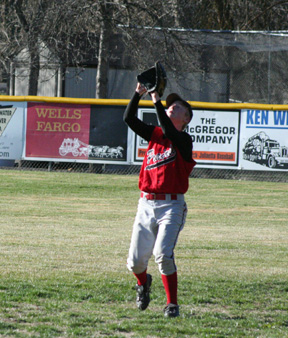 Silas Whitley is about to catch a fly ball for an out in the Kendrick game.