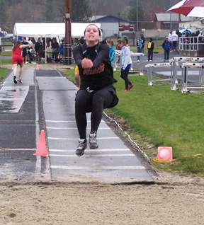 Ashley Shumway stretches for the pit in the long jump. Photo by Kayla Lorentz.