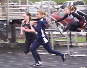 NaTosha Schaeffer and Grangevilles Sheyenne Stewart race to the finish off the last hurdle in the 100 meter hurdles. Stewart edged out Schaeffer for first place. Photo by Kayla Lorentz.