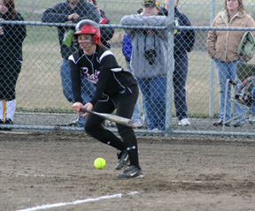 Amber Holthaus tries to drag bunt the ball from the left side in the Timberline game.
